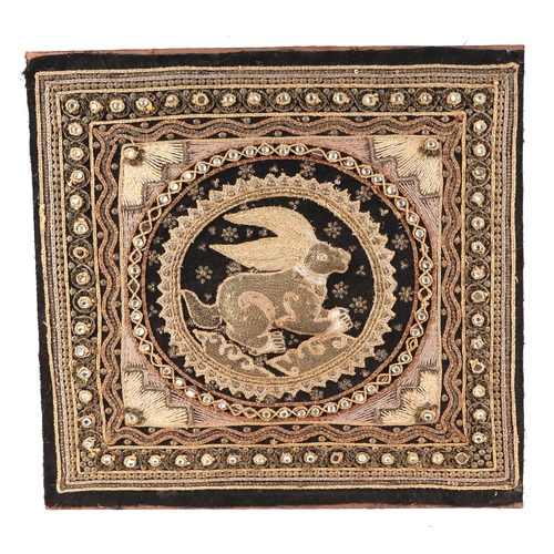 136 - A group of four Indian needlework panels, depicting elephants and mythical creatures, each approx 39... 