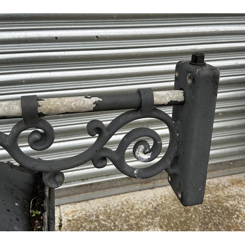 15 - A Victorian style cast aluminium pub lantern, mounted on a wall bracket, approx 80cm high.