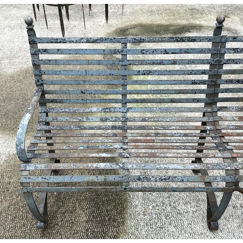 20 - An impressive well weathered iron strapwork three-section corner bench, overall 160 by 160cm.