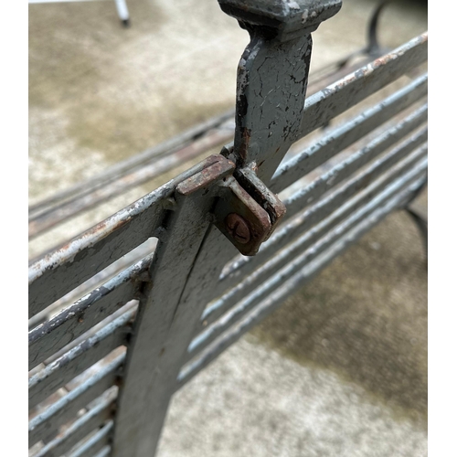 20 - An impressive well weathered iron strapwork three-section corner bench, overall 160 by 160cm.