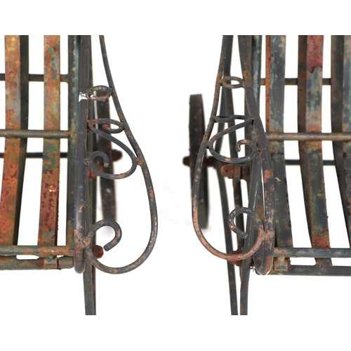 25 - A pair of folding metal garden loungers (2).