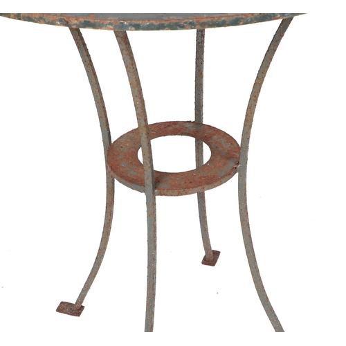 30 - A well weathered painted metal garden table, with central hole holding a plant pot, 70cm diameter.