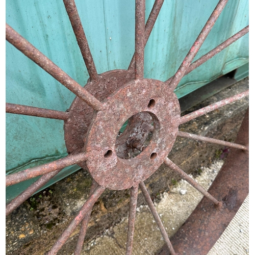 33 - A large pair of iron spoke cart wheels, 121cm diameter (2),