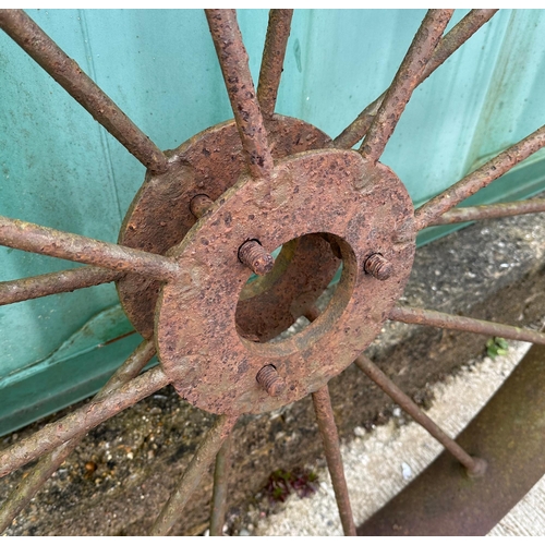 33 - A large pair of iron spoke cart wheels, 121cm diameter (2),