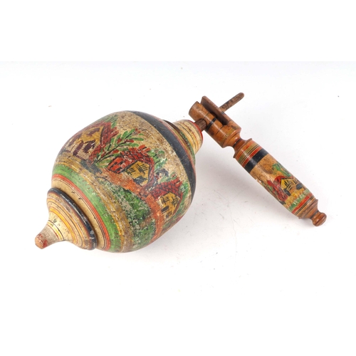 373 - A turned wooden painted folk art spinning top, 32cm high.