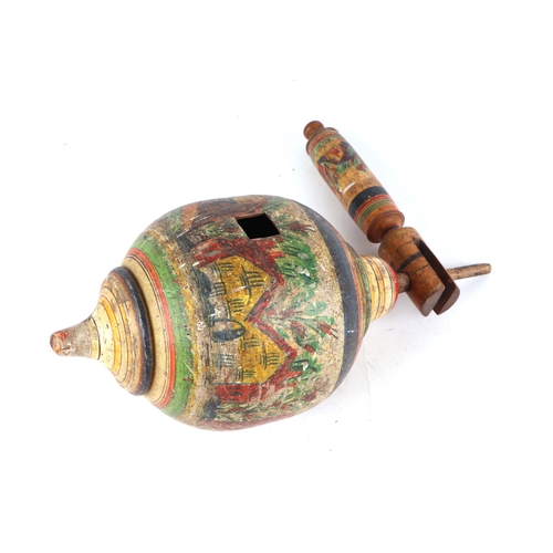373 - A turned wooden painted folk art spinning top, 32cm high.