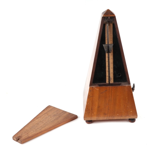 376 - A late 19th century walnut French metronome, 23cm high.