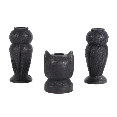380 - A pair of Irish carved bog oak needle / bobbin holders, in the form of owls, 8cm high, and another i... 