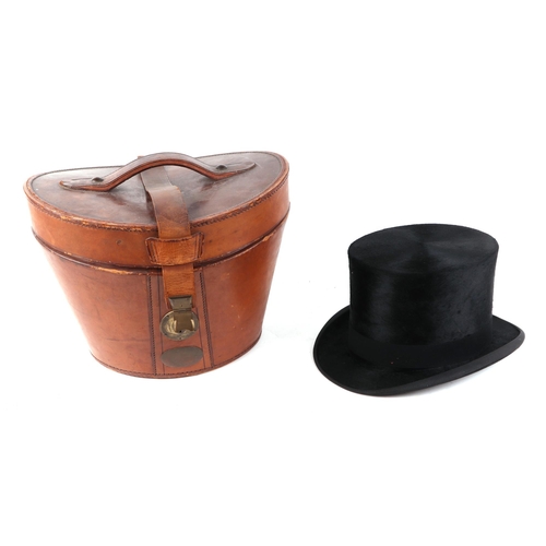 382 - A Tress & Co London silk top hat, 60cm circumference, together with a leather travelling case (2).