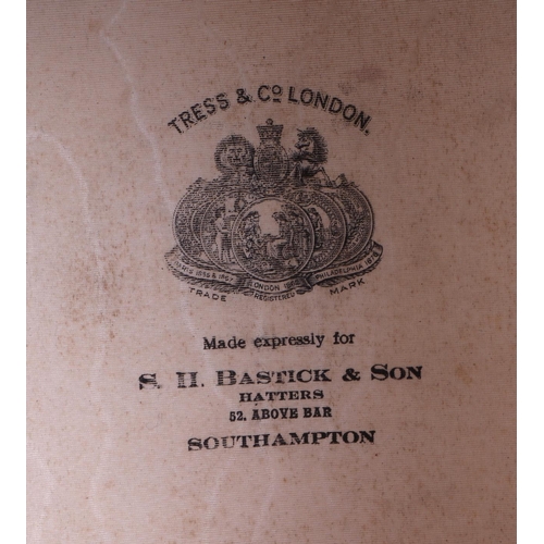 382 - A Tress & Co London silk top hat, 60cm circumference, together with a leather travelling case (2).
