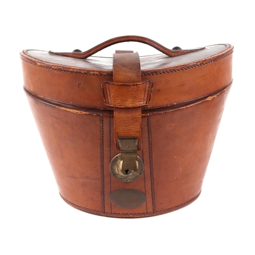 382 - A Tress & Co London silk top hat, 60cm circumference, together with a leather travelling case (2).