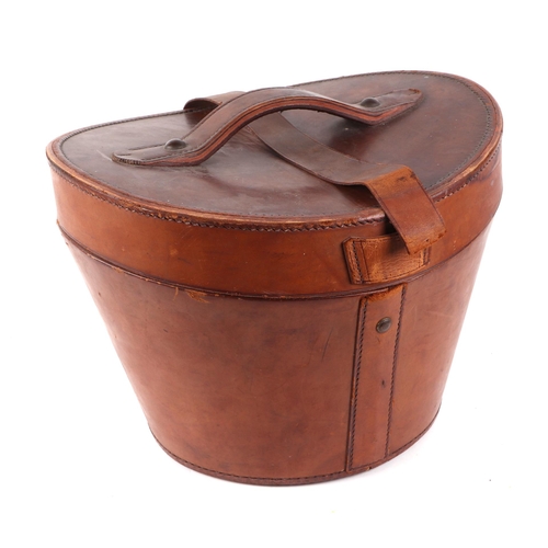 382 - A Tress & Co London silk top hat, 60cm circumference, together with a leather travelling case (2).