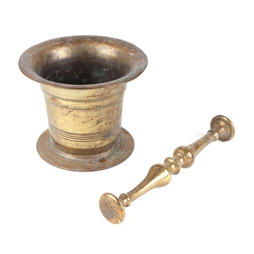385 - A brass pestle and mortar, 14cm diameter.