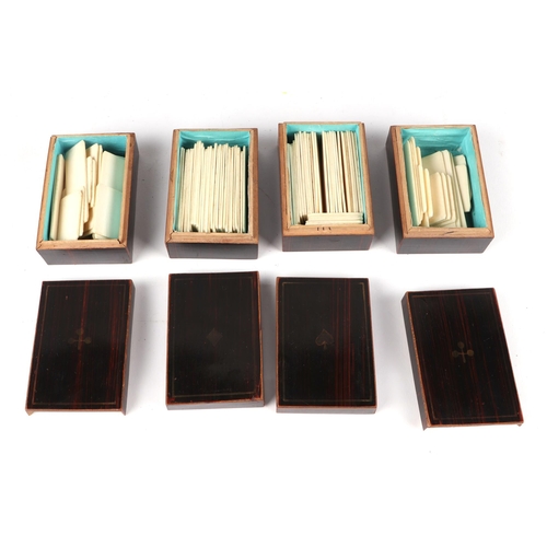 386 - An Edwardian burr walnut travelling playing card case, opening to revel four containers of game chip... 