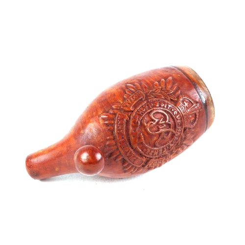 388 - A treen carved pipe bowl, with Royal G R insignia.