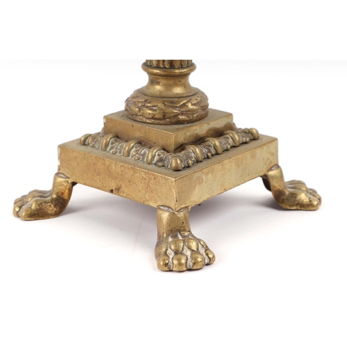 393 - A pair of French brass Empire style candlesticks with eagle perched on bull sconces, Corinthian colu... 