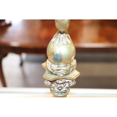393 - A pair of French brass Empire style candlesticks with eagle perched on bull sconces, Corinthian colu... 