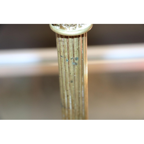 393 - A pair of French brass Empire style candlesticks with eagle perched on bull sconces, Corinthian colu... 