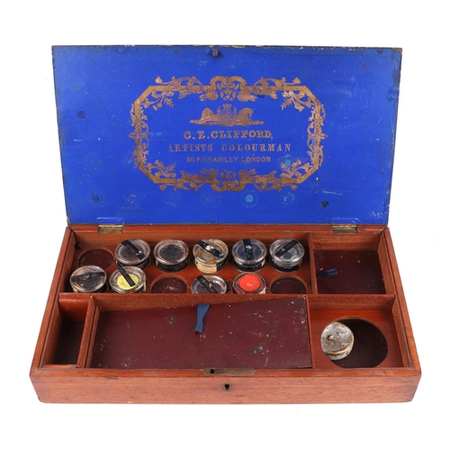 395 - A C E Clifford Artist Colourman mahogany paint box, having a fitted interior and selection of brass ... 