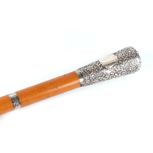 396 - A late 19th century Malacca walking stick, with white metal band, ornate white mental handle, 91.5cm... 
