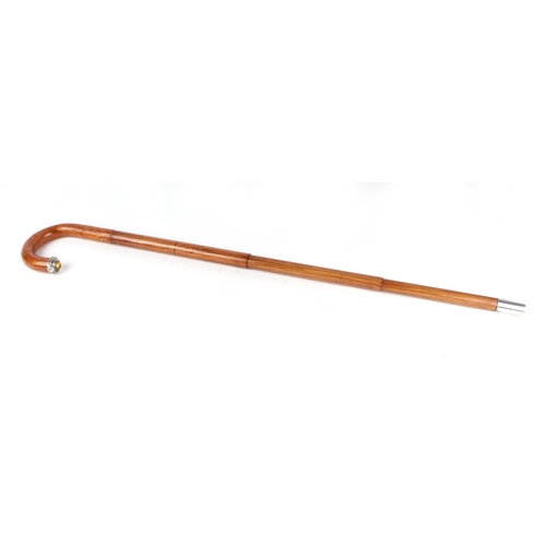 398 - An Edwardian umbrella walking stick, with white metal and citrine mount, 90cm long.