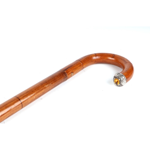 398 - An Edwardian umbrella walking stick, with white metal and citrine mount, 90cm long.