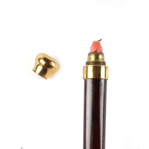 399 - A stained hardwood novelty walking cane, with brass handle, concealing an ejecting candle, 92cm long... 