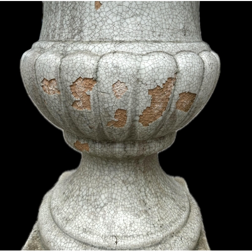 40 - A large impressive pair of crackle glazed pottery Campana urns, with lion mask handles, 98cm high (2... 