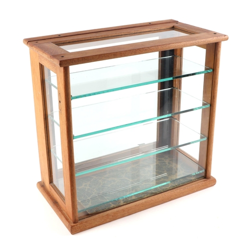 401 - An oak framed table top glass display cabinet, with four internal glass shelves, 39cm wide.