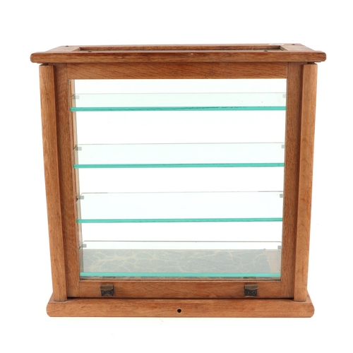 401 - An oak framed table top glass display cabinet, with four internal glass shelves, 39cm wide.
