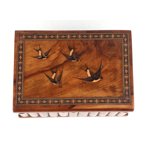 402 - An Italian Sorrento ware jewellery box, the top decorated with swallows, 24cm wide.