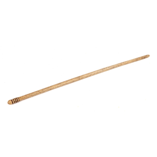 404 - A 19th century turned bone conductors baton, 46cm long.
