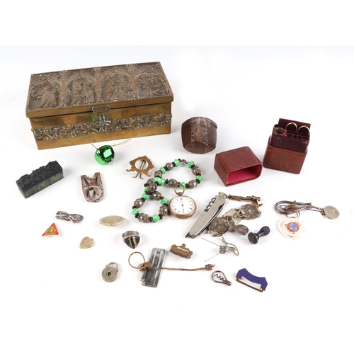 407 - A Victorian Gothic revival brass casket jewellery box, 22cm wide, with contents including costume je... 