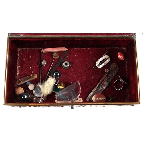 407 - A Victorian Gothic revival brass casket jewellery box, 22cm wide, with contents including costume je... 