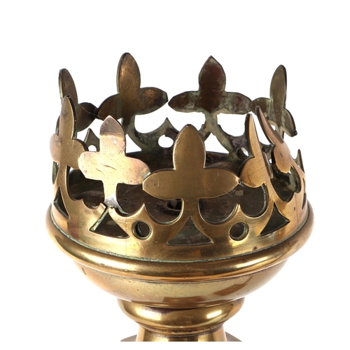 412 - A pair of gothic revival brass and iron candle sticks, on oak bases, 63cm high (2).