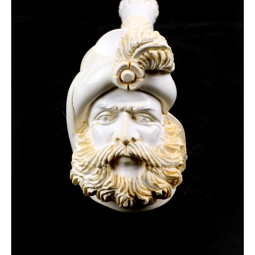 421 - A large two piece meerschaum pipe in the form of a bearded man, overall 42cm long, cased.