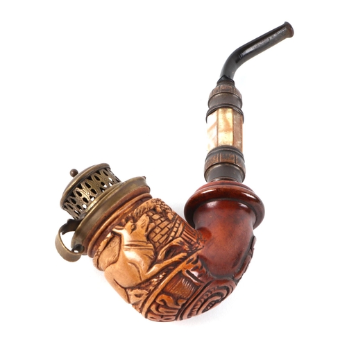 422 - A German pipe, the bowl carved with a dog and dated 1862, having a mother of pearl shaft, 18cm long.