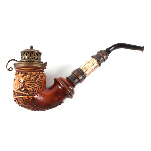 422 - A German pipe, the bowl carved with a dog and dated 1862, having a mother of pearl shaft, 18cm long.