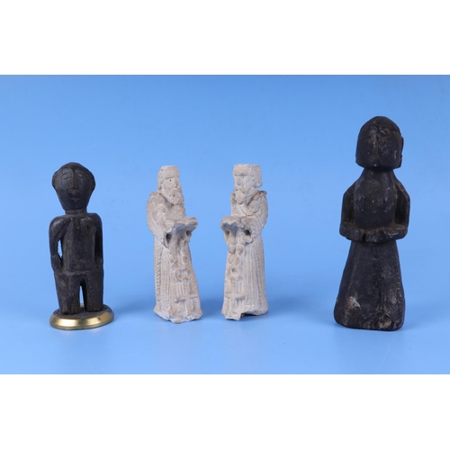 437 - A pair of medieval style carved limestone figures of monks, 14cm high, a carved ethnic wooden figure... 