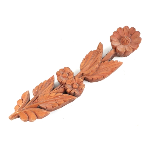 440 - A carved oak corbel, in the form of a putti, possible 18th century, 65cm high, and a pine pineapple ... 