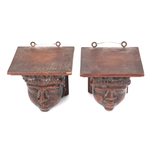 441 - A pair of carved fruit wood corbels, in the form of a King and Queen, possible medieval, each 14cm h... 