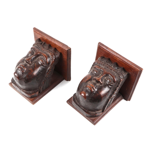 441 - A pair of carved fruit wood corbels, in the form of a King and Queen, possible medieval, each 14cm h... 