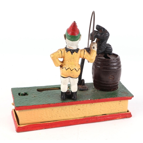 456 - A vintage cast iron Mr Trick dog money box, 20cm wide.
