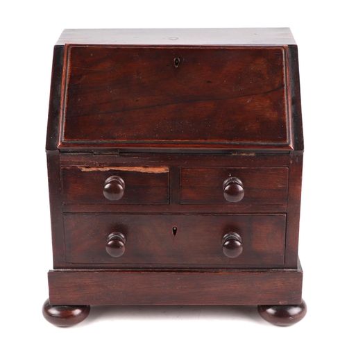 458 - A 19th century rosewood apprentice piece in the form of a bureau , the fall front enclosing four sho... 