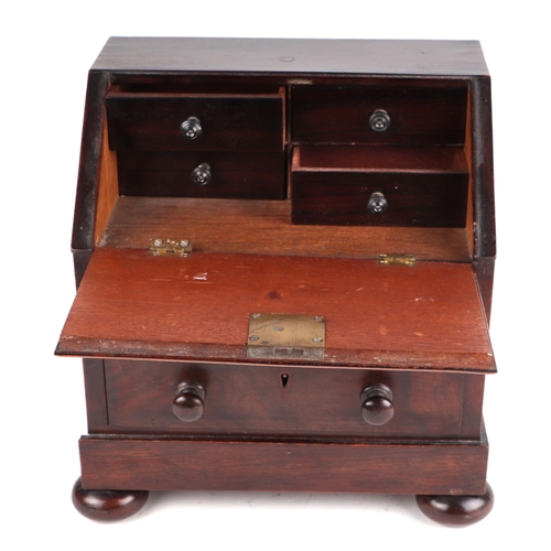 458 - A 19th century rosewood apprentice piece in the form of a bureau , the fall front enclosing four sho... 