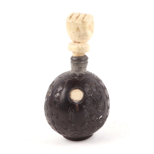 472 - A late 18th / early 19th century carved hardwood snuff bottle, decorated flowers, with carved bone s... 