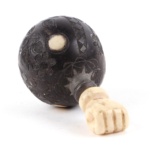 472 - A late 18th / early 19th century carved hardwood snuff bottle, decorated flowers, with carved bone s... 