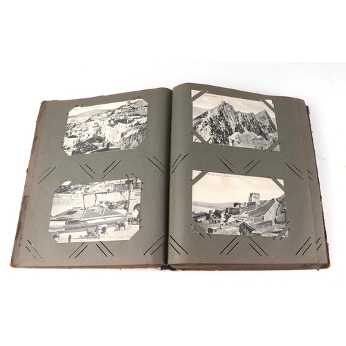 54 - An early 20th century postcard album, containing ethnographic, architectural, European and other sim... 