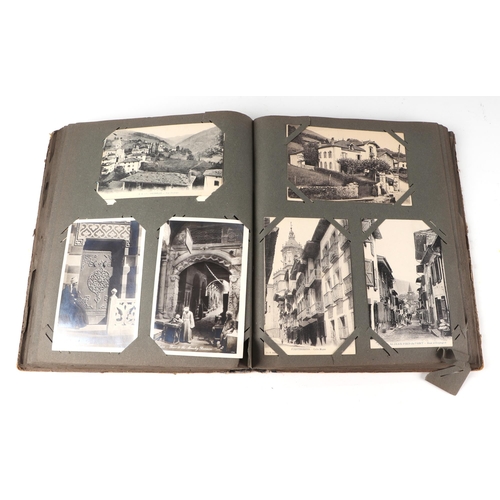 54 - An early 20th century postcard album, containing ethnographic, architectural, European and other sim... 