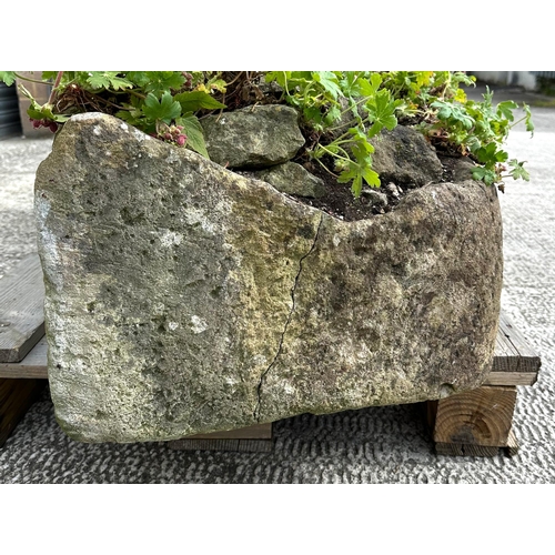 7 - A very large and heavy stone trough planter, 159 by 47 by 30cm high.